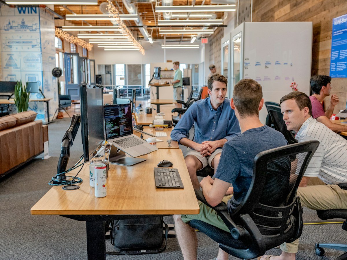 Team reviewing documents and content at a table
