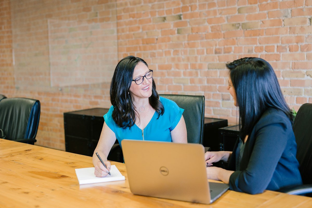 Colleagues discussing a business project in a professional meeting